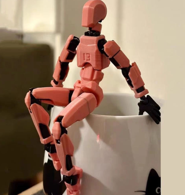 Pomarańczowy ruchomy robot z druku 3D